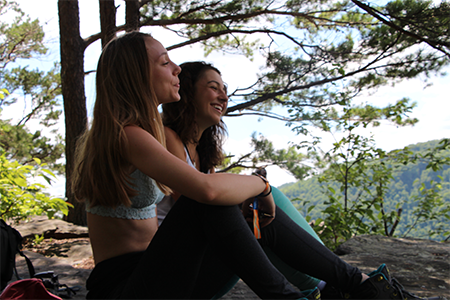Friends bonding on a yoga retreat at the New River Gorge in West Virginia.