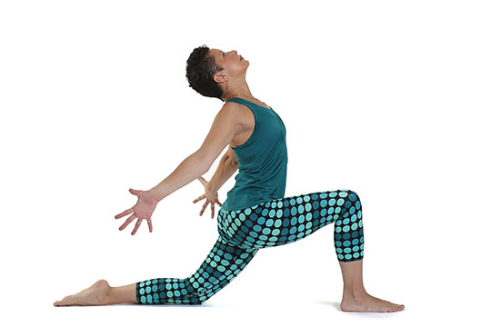 Cheryl Barclay posing in anjaneyasana, low lunge hot yoga pose.